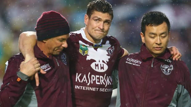 Bad night: Matt Ballin of the Sea Eagles leaves the field injured.