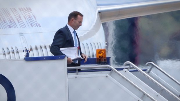 Prime Minister Tony Abbott returns to Canberra to attend a cabinet meeting at Parliament House.