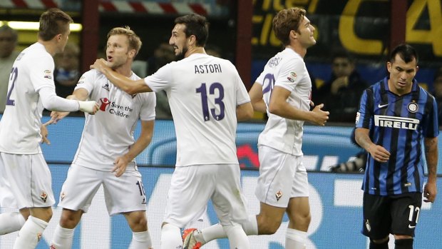 Fiorentina players celebrate one of Nikola Kalinic's three goals.
