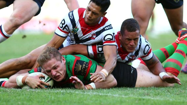 Too late: Roosters defenders fail to stop George Burgess from scoring.