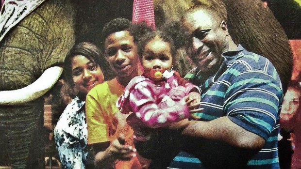 An undated photo of Eric Garner with his family. 