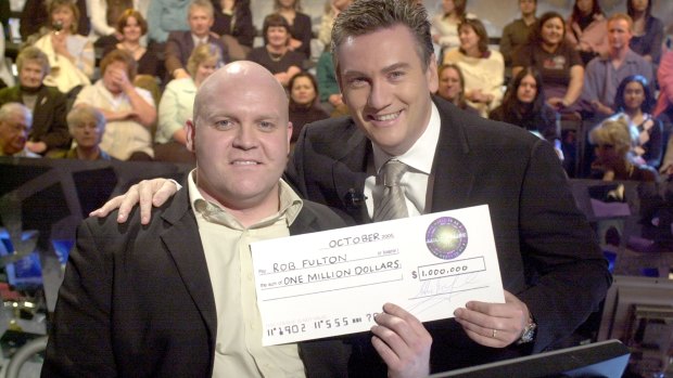 Game show host Eddie McGuire and winning contestant Rob Fulton in 2005.