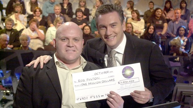 Game show host Eddie McGuire and winning contestant Rob Fulton in 2005.