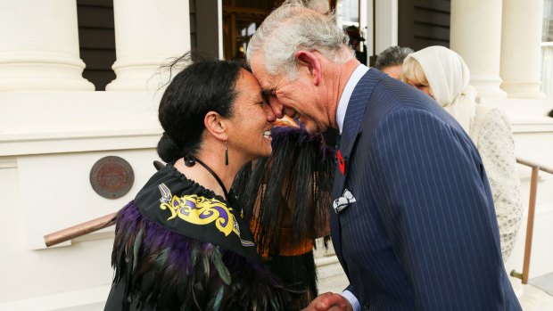 Prince Charles, welcomed with a hongi from New Zealand Defence Force Flight Sergeant Wai Paenga.