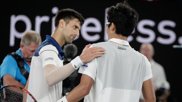 Novak Djokovic congratulates Hyeon Chung after his win.