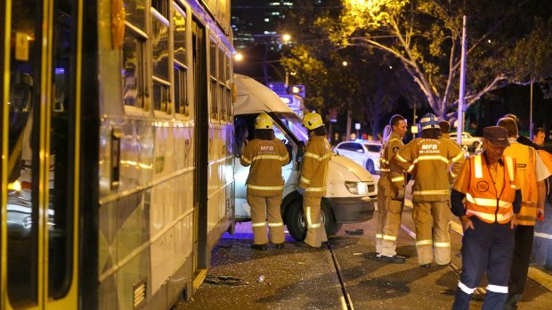 Emergency services at the scene of a collision between a tram and a van on St Kilda Road on Saturday night.