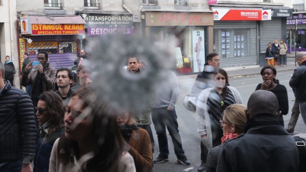 Bullet holes adjacent to the La Belle Equipe cafe in Paris France.