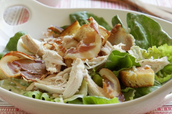 Caesar salad with barbecue chicken or chicken thighs.