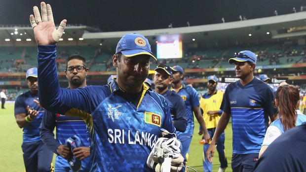 Sri Lanka's Kumar Sangakkara waves to the crowd as he leaves the field after the quarter-final against South Africa.