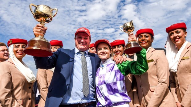 Winners are grinners: Darren Weir and Michelle Payne celebrate their Melbourne Cup win in 2015. 