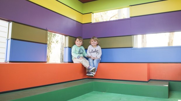 Tom, 3 and Lottie Searle, 2, are right at home in the Lego-themed cubby house for Floriade.