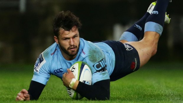 Over he goes: Adam Ashley-Cooper dives over to score for the Waratahs. 