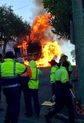 Moments after the road cutter erupted in flames in Neutral Bay.