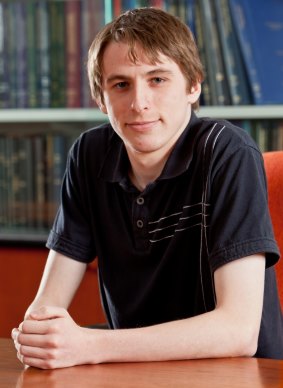 Curtis Black, who is studying properties of the Higgs boson using data from the Large Hadron Collider.