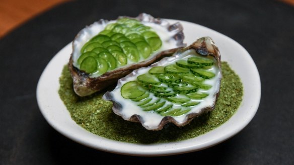 Oysters topped with sliced mouse melons at O.My.