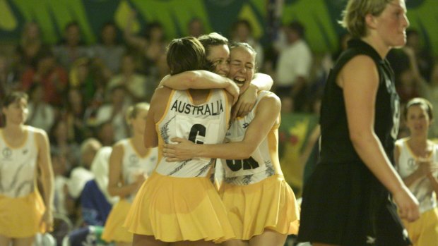 The Australian team celebrate after beating New Zealand in the final 42-39.