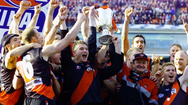 Bomber glory: Captain James Hird and coach Kevin Sheedy lift the 2000 AFL premiership cup.