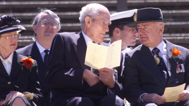Former chair of the Australian War Memorial Major-General  William  'Digger' James (CENTRE) and the Governor-General Sir William Deane and Lady Deane during the 2000 Remembrance Day ceremony. 