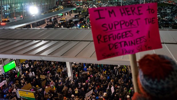Protesters assemble at John F. Kennedy International Airport in New York on Saturday.