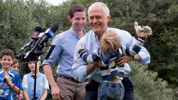 Prime Minister Malcolm Turnbull with grandson Jack Turnbull Brown and Education Minister Simon Birmingham in Double Bay.