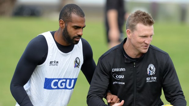 Heritier Lumumba with Nathan Buckley at a Collingwood training session in 2014.