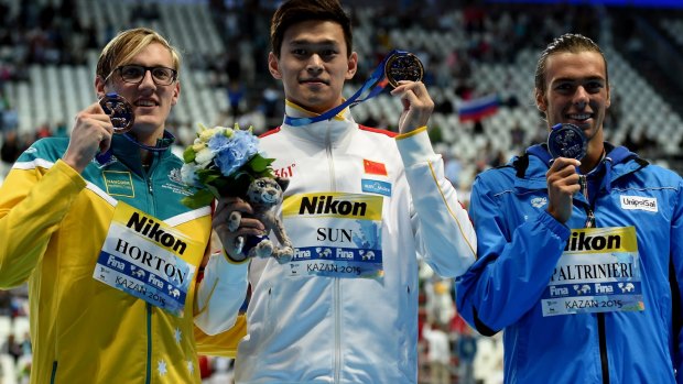 The medallists:  Horton with gold medallist Yang Sun of China with silver medallist Gregorio Paltrinieri.