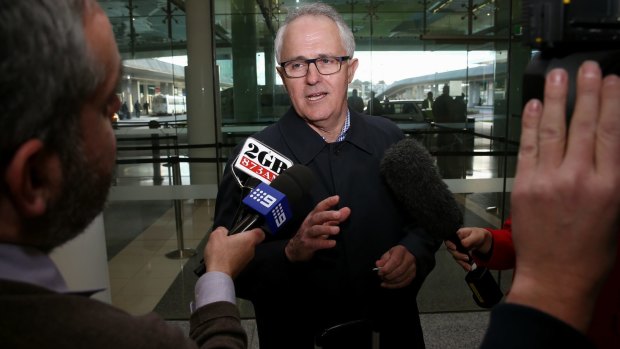Communications Minister Malcolm Turnbull arrives at Canberra Airport on Sunday. 