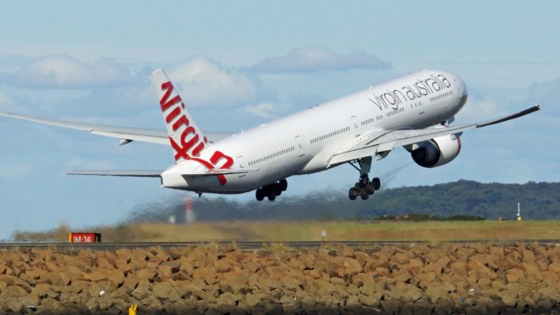 A radio hoaxer told a Virgin pilot to abort a landing.