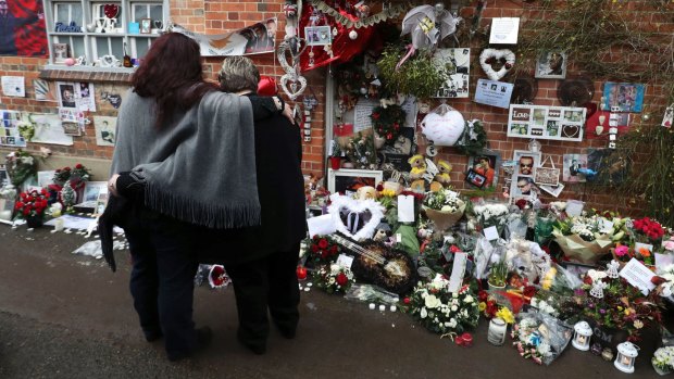 Tributes are left at the home of singer George Michael in Goring-on-Thames on Monday to mark the one-year anniversary of his death.