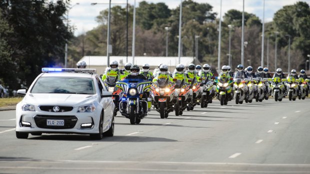 A long convoy of motorbikes makes its way down Northbourne Avenue during the 2017 Wall to Wall Ride for Remembrance. 