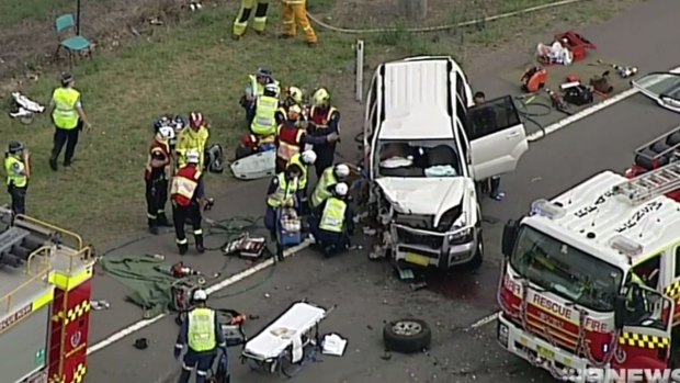 Emergency services at the scene of a head-on car crash in Luddenham.