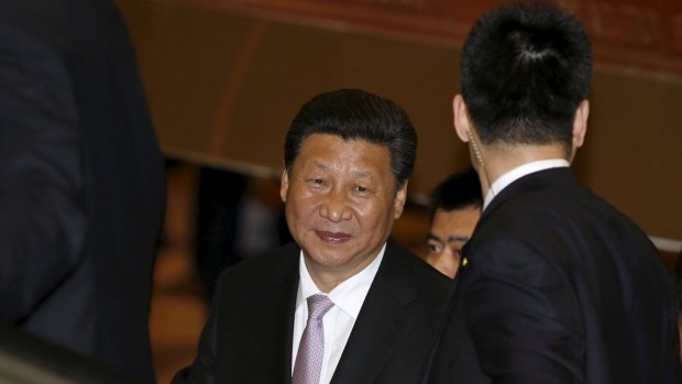 Chinese President Xi Jinping rides an escalator after meeting with Japanese Prime Minister Shinzo Abe.