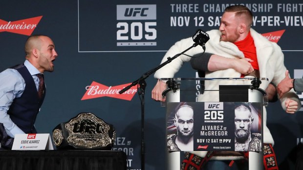 UFC president Dana White separates Conor McGregor and Eddie Alvarez during the UFC 205 press conference.