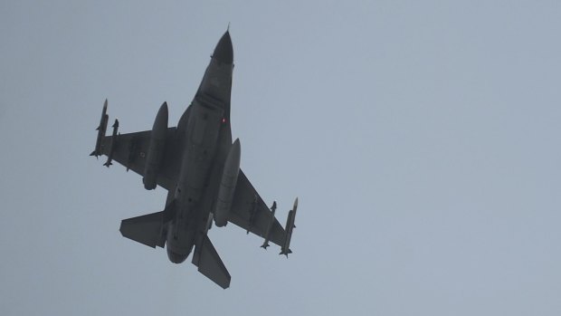 A Turkish Air Force fighter jet flies over the Incirlik Air Base in southern Turkey.