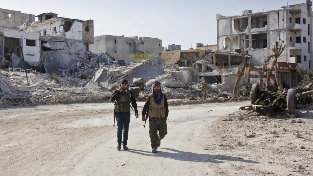 YPG soldiers near their strongholds in the border town of Kobane, Syria.