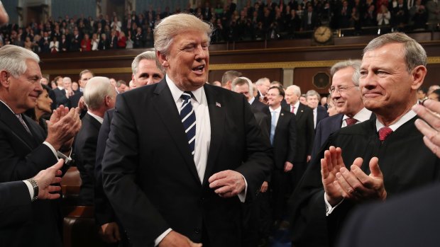 US President Donald Trump arrives in Congress before his 'conciliatory' speech.