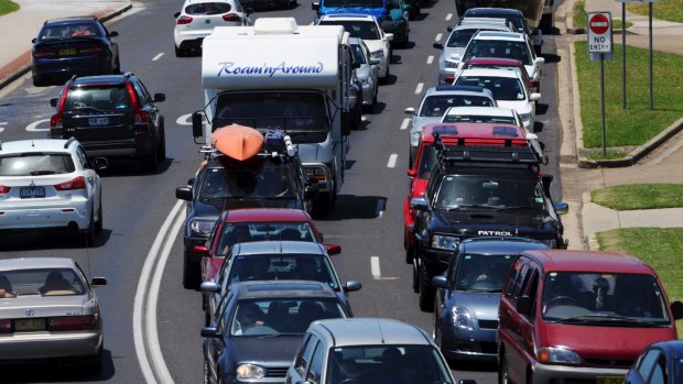 Returning holidaymakers face long delays on roads back to Sydney.