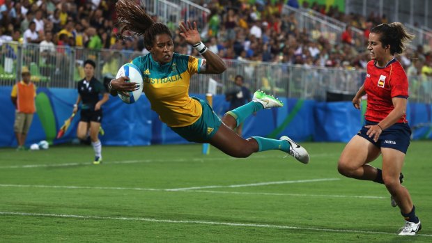  Ellia Green of Australia dives in to score a try against Patricia Garcia of Spain during the Women's quarter-final.
