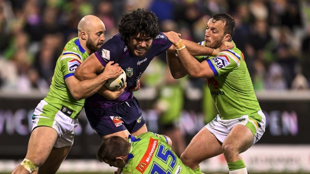 Green wall: Tohu Harris takes on the Canberra Raiders at GIO Stadium.