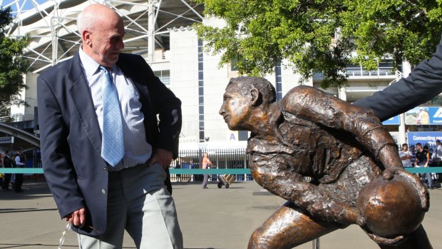 Solid status: Ken Catchpole stands with a bronze statue of his likeness outside the SFS in honor as one of the greatest Wallaby Test players ever. 