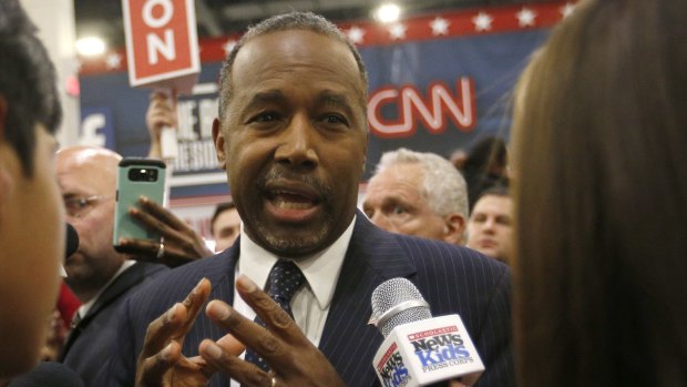 Ben Carson speaks to the press in the "spin room" following the  debate. Once a close rival to Trump, the focus on foreign affairs and questions over his autobiography have seen his ratings tumble.
