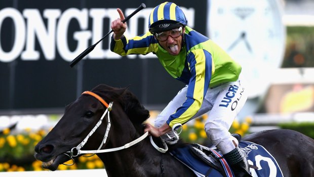 Cheeky: Damien Oliver celebrates Lucia Valentina's win in the Queen Elizabeth Stakes.