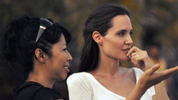Loung Ung (left) and Angelina Jolie during the making of the film First They Killed My Father. 