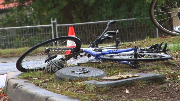 A bicycle lies abandonded near the site a woman was killed after a collision with a car on Mona Vale Road.