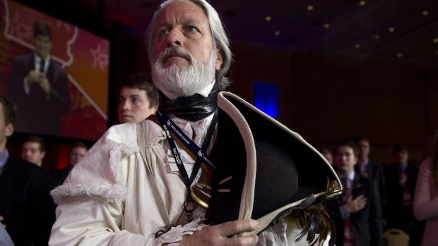 William Temple from the Golden Isles Tea Party, dressed as Declaration of Independence signer Button Gwinnett, holds his hat during the Pledge of Allegiance at the Conservative Political Action Conference in National Harbor, Maryland, US. 