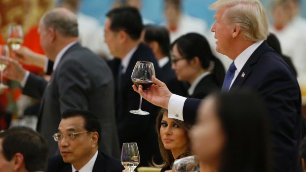 US President Donald Trump and first lady Melania Trump attend a state dinner at the Great Hall of the People in Beijing.