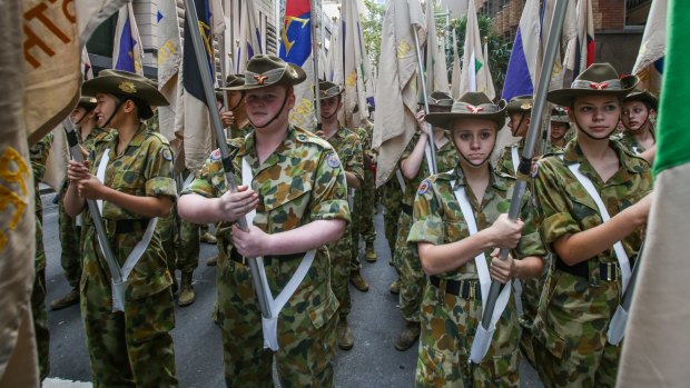 Army cadets with the unit flags of World War I prepare for the Anzac Day march.