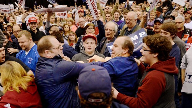 A protester, centre left, and a Trump supporter, centre right, scuffle during a rally for Republican presidential candidate Donald Trump in Ohio on March 12.