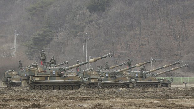 South Korean soldiers stand on their K-55 self-propelled howitzers during the annual military exercise in Paju, near the border with North Korea on Monday.
