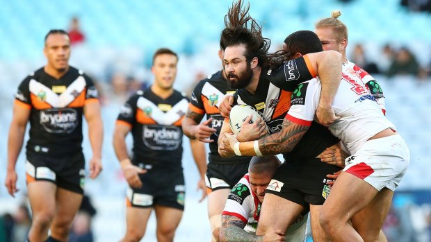 Strong run: Aaron Woods surges ahead for the Tigers.